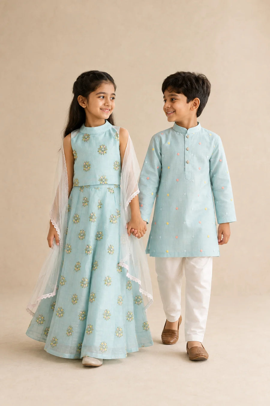 Aqua Noor sibling set featuring a boy kurta and girl lehenga in vibrant aqua, by Marwar Roots, displayed on a plain background.