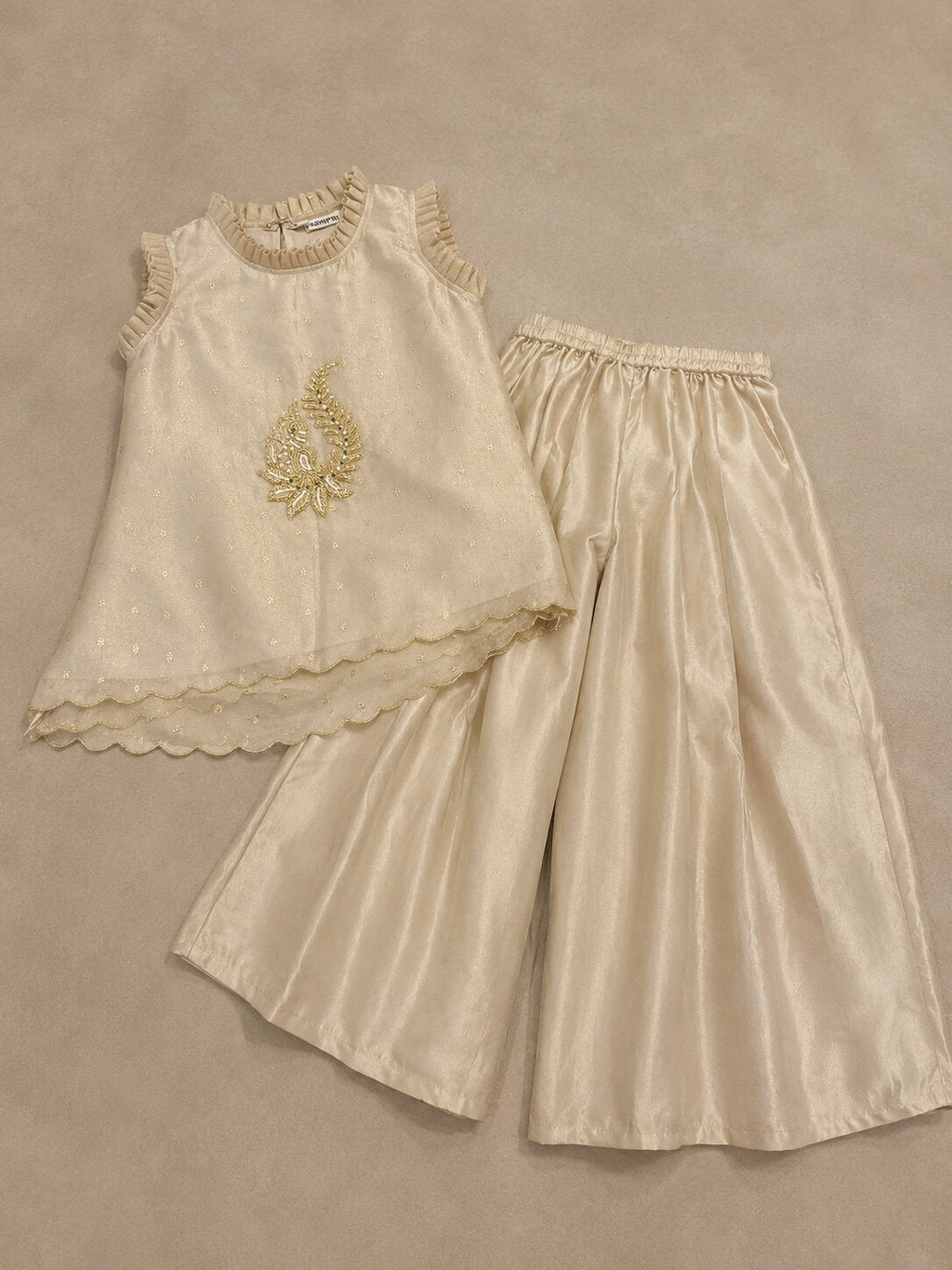 Ivory gold embroidered Indo-Western sharara set for girls with ruffle top and flared pants