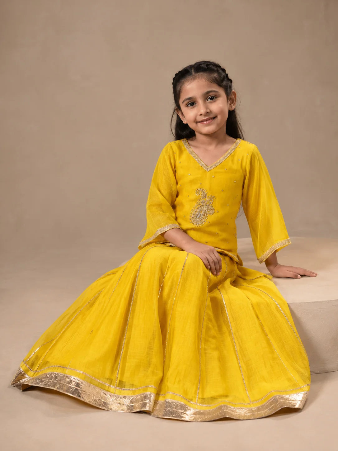 Yellow embroidered girls lehenga set with dupatta and flared skirt