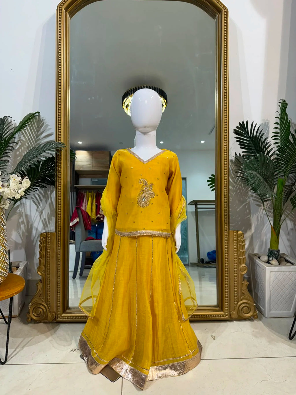 Yellow embroidered girls lehenga set with dupatta and flared skirt