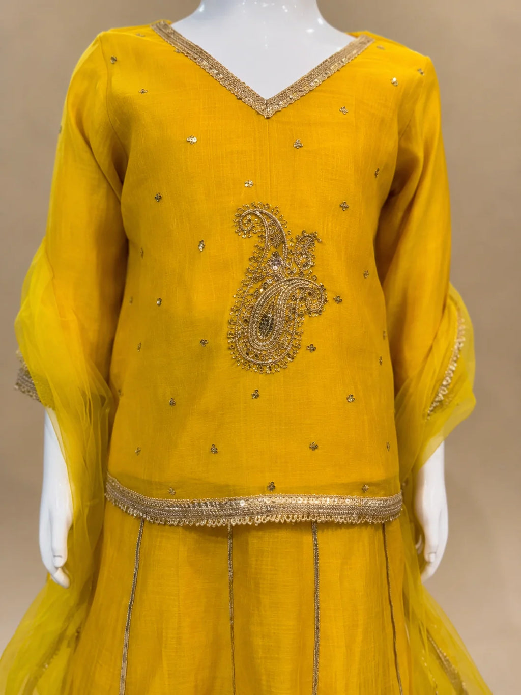 Yellow embroidered girls lehenga set with dupatta and flared skirt