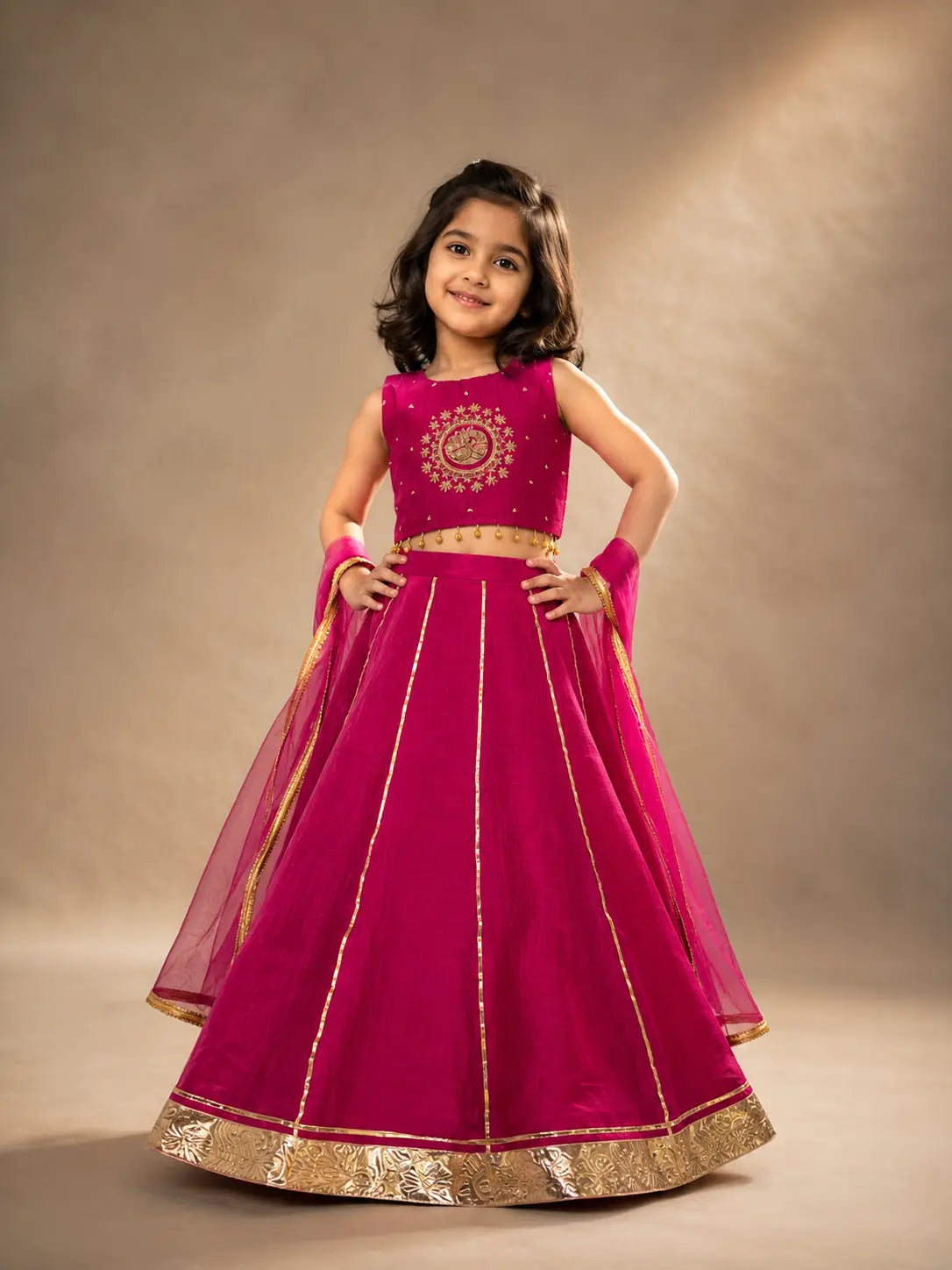 Rani pink embroidered girls lehenga set with dupatta and gold detailing