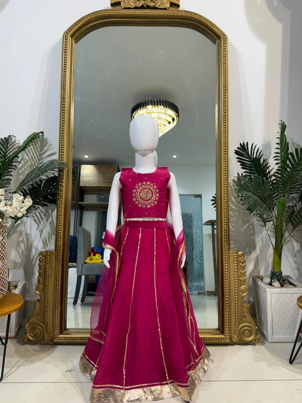 Rani pink embroidered girls lehenga set with dupatta and gold detailing