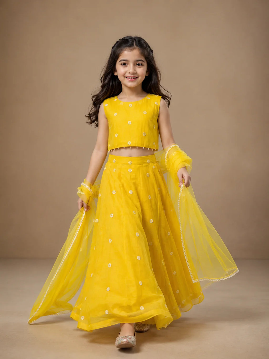 Yellow floral girls lehenga choli set with dupatta and pearl tassel detailing