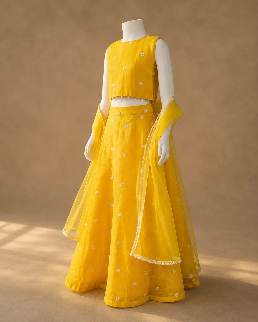 Yellow floral girls lehenga choli set with dupatta and pearl tassel detailing