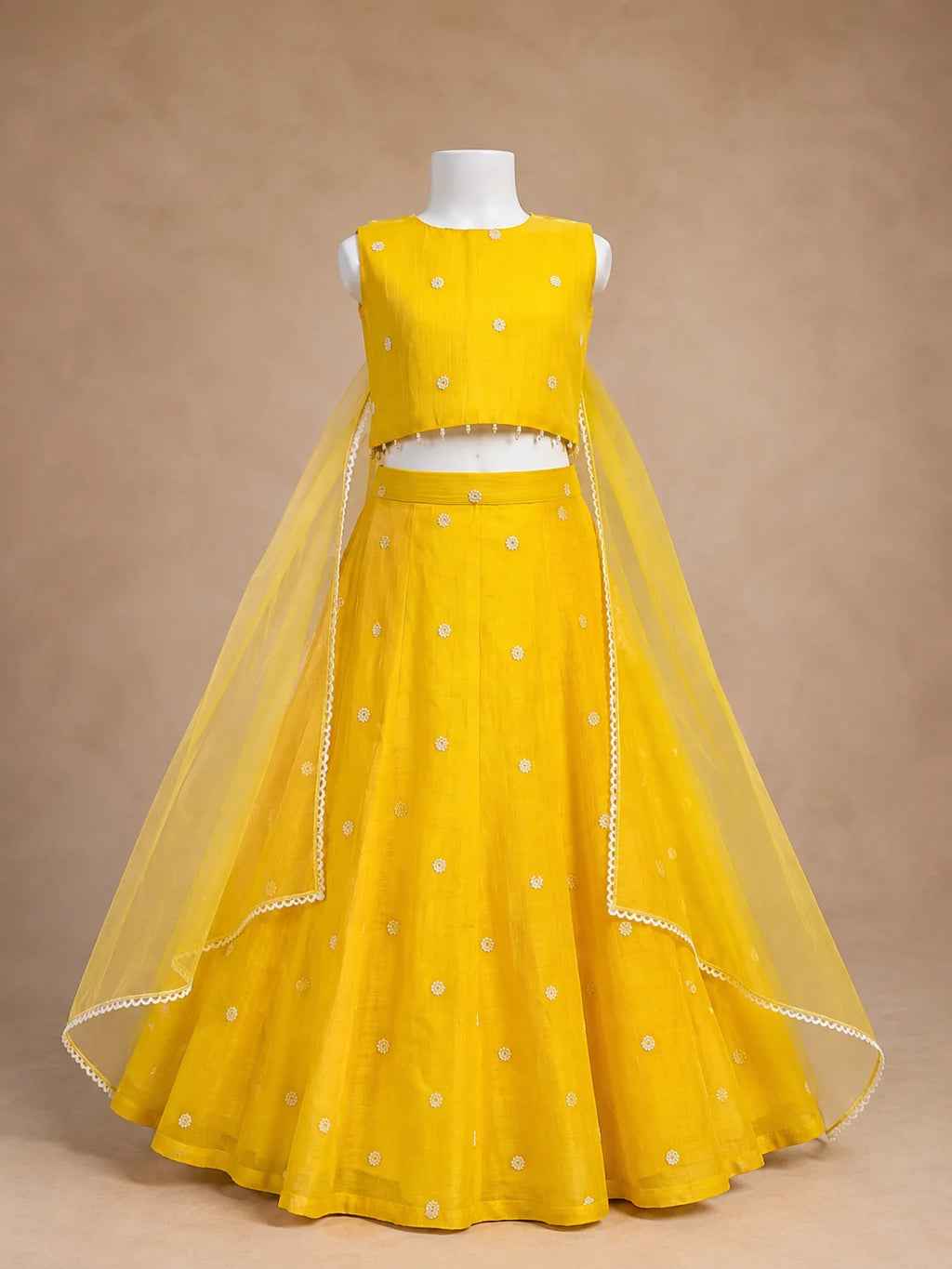 Yellow floral girls lehenga choli set with dupatta and pearl tassel detailing