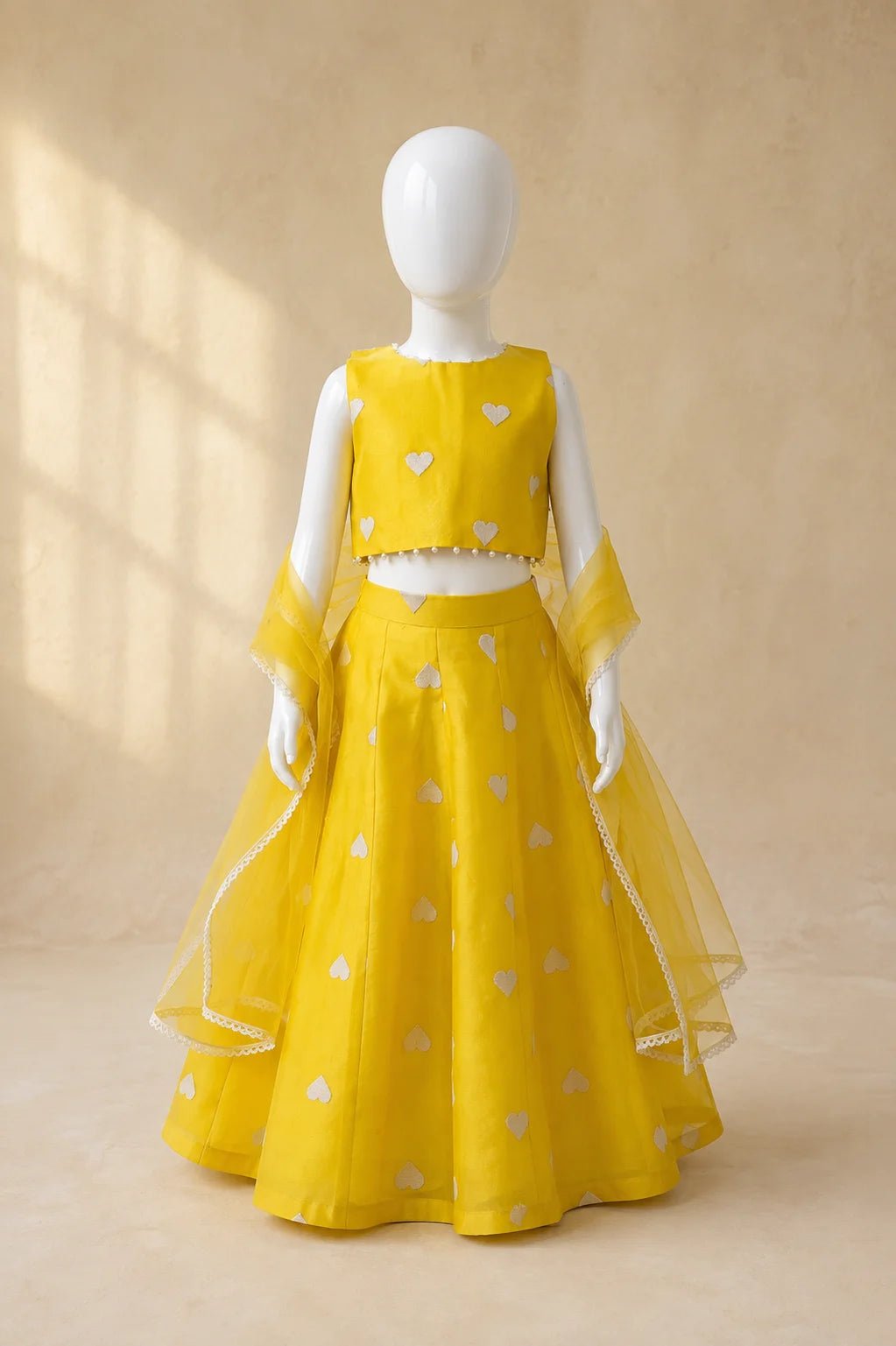 Yellow heart motif Lehenga set by Marwar Roots featuring traditional embroidery and vibrant fabric for festive occasions.