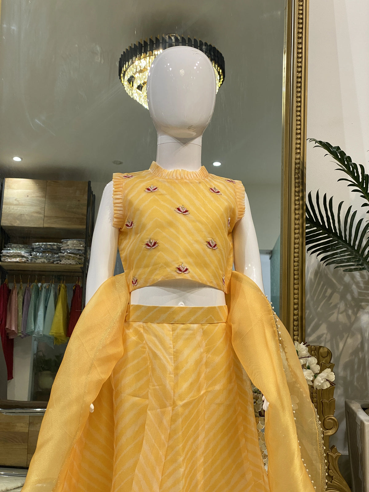 Girls sunshine yellow striped lehenga set with embroidered sleeveless blouse and sheer dupatta