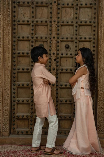 Pink and white twinning boy kurta and girl indo-western set by Marwar Roots, featuring traditional and stylish matching outfits.