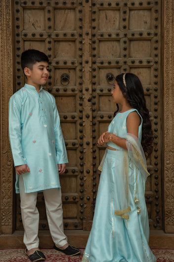 Blue heart twinning boy kurta set and girl lehenga set by Marwar Roots, perfect for siblings' special occasions.