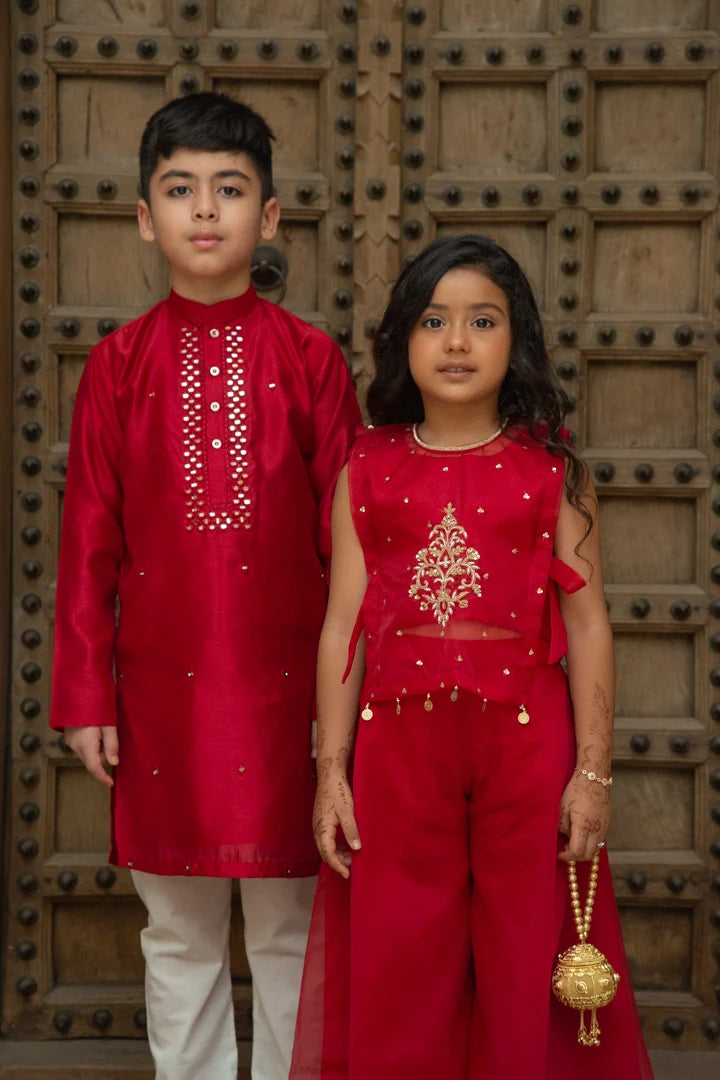 Matching red boy kurta and girl indo-western sibling set by Marwar Roots, featuring traditional and stylish designs.