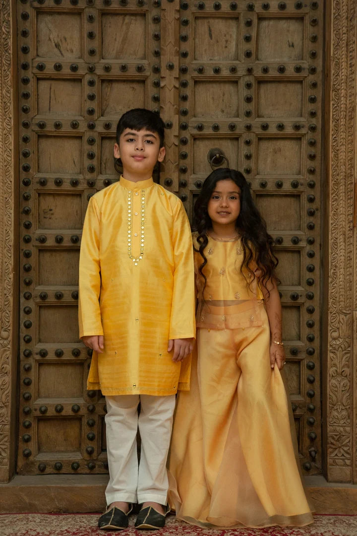 Yellow Kurta set with mirror and butti embroidery, Indo-Western style by Marwar Roots, featuring vibrant yellow fabric and intricate detailing.